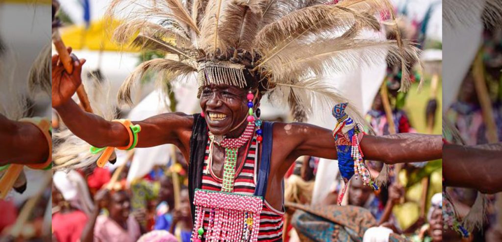 Iteso man showcasing the traditional dance of Iteso people